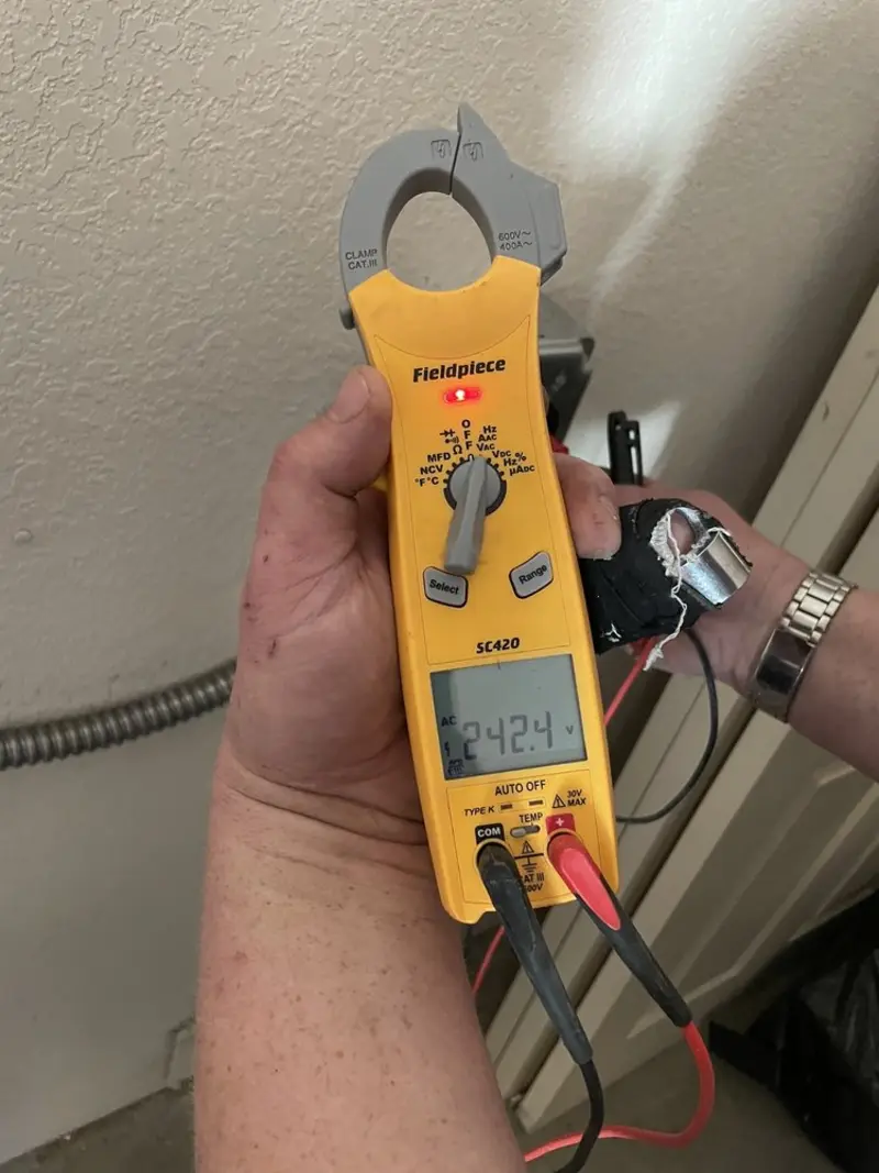 Voltage testing with clamp meter during Electrical Installation Services in Montgomery